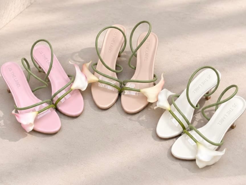 A pair of JS The Label heels, paused mid-step